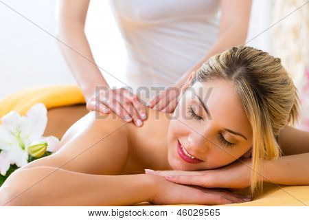 Wellness - woman receiving body or back massage in spa