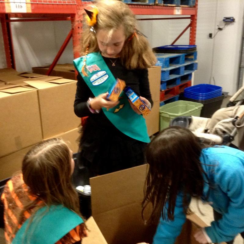 Girl Scouts sorting Dreadwood donations.
