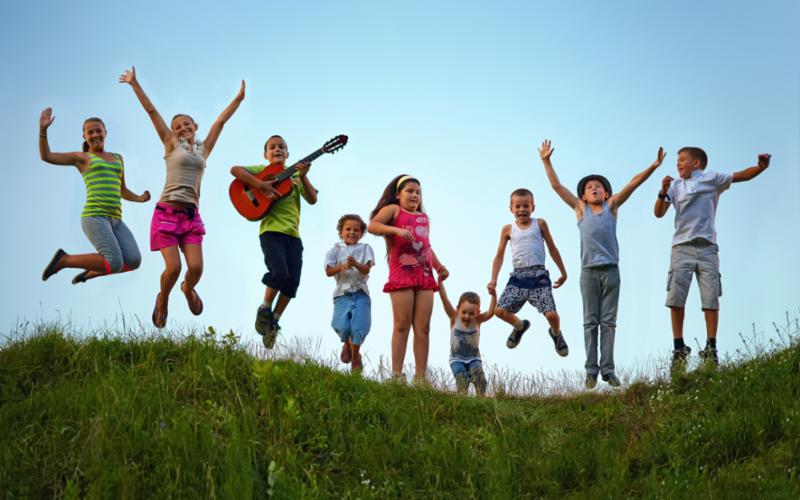 kids_jumping_on_hill.jpg