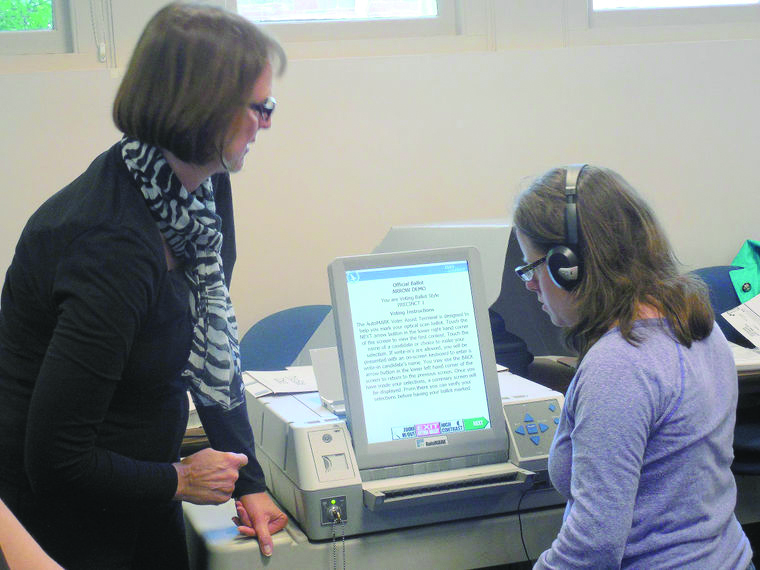 woman assisting another woman with the AutoMARK