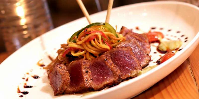Mattison_s Forty-One_s Togarashi Crusted Ahi Tuna  stir fried soba noodles_ Thai green papaya salad_ Papaya glaze in Sarasota Florida