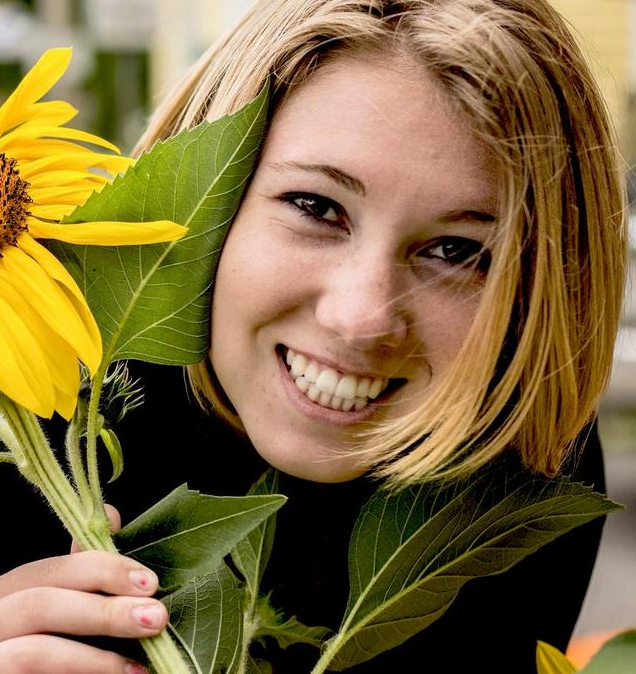 Sarah Hurd with a sunflower