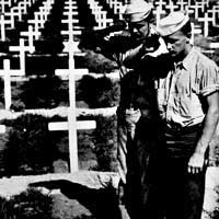 troops salute grave