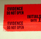 tape printed with Evidence, Do Not Open