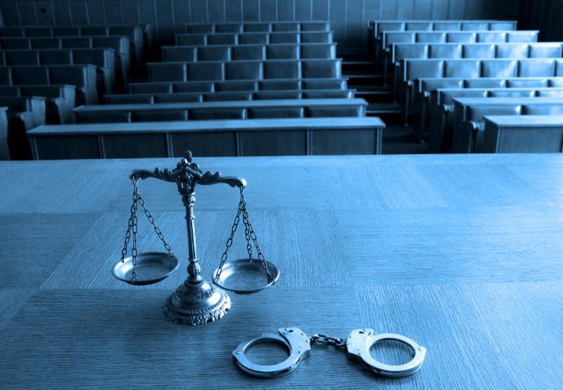 photo of justice scales and handcuffs