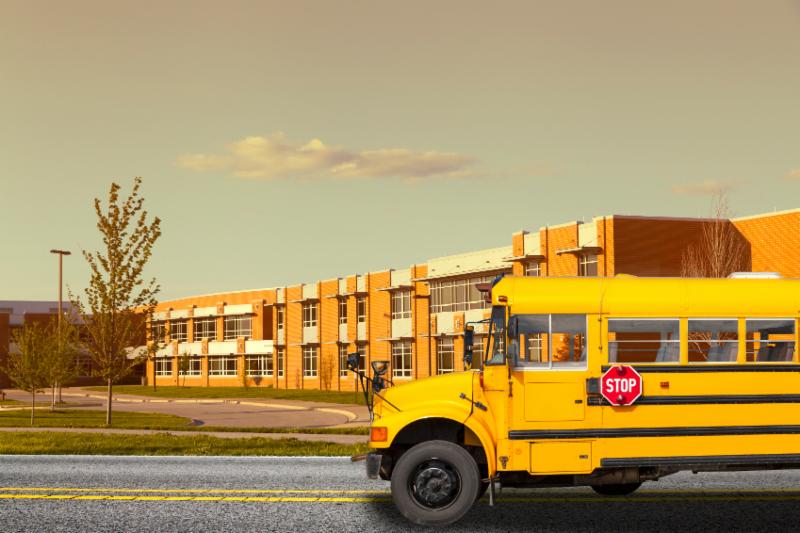 school bus in front of school