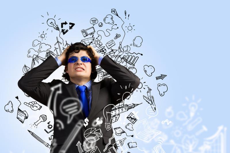 Image of depressed businessman tearing his hair