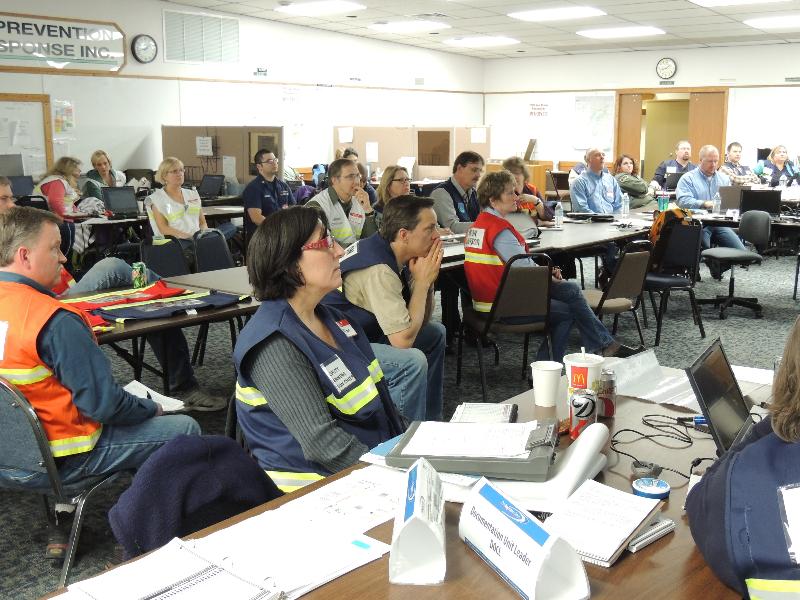 Drill participants go over spill scenario for Cook Inlet Pipe Line