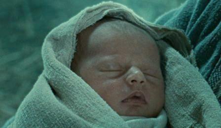 A baby wrapped in cloths