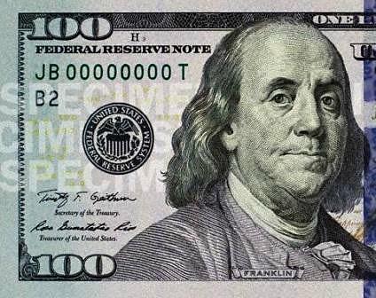 Half of a US 100 Dollar bill