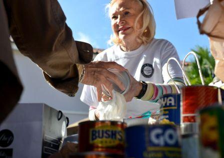 Woman helping to feed others