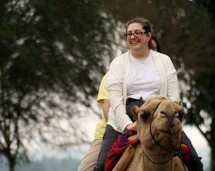 Pamela Higgins riding a camel