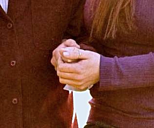 Hands holdin onto the arm of another