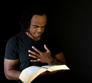 A man studying an open Bible