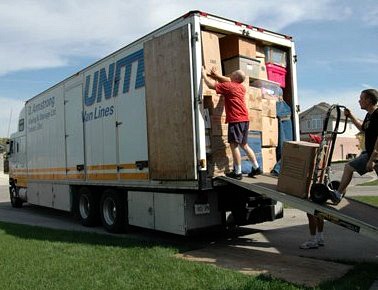 Men packing a United moving van