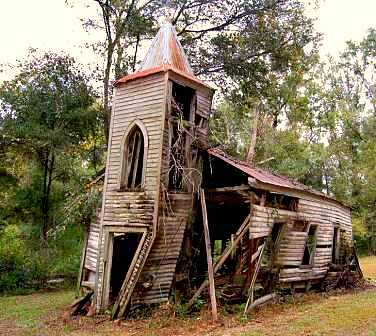 An old wooden church falling apart.
