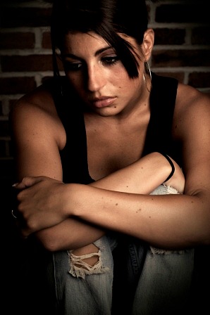 A woman, alone and disappointed