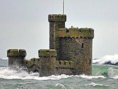 The Isle of Man's Tower of Refuge surrounded by the stormy sea