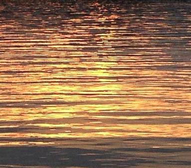Sunset reflected on a windblown lake