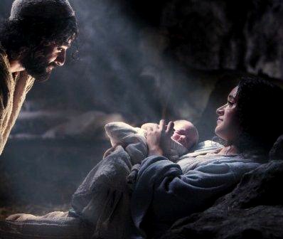 Joseph looking down on Mary and the newborn baby