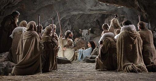 Shepherds kneeling before the baby Jesus