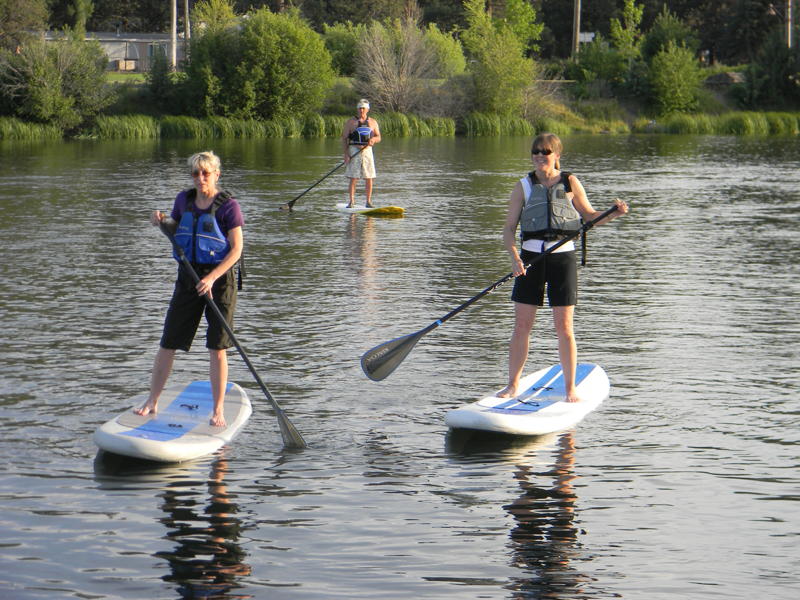 paddle boarders on the lake