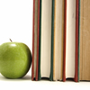 Image of an apple with a stack of books