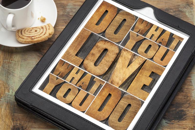 do what you love, love what you do - motivational word abstract in vintage letterpress wood type on a digital tablet