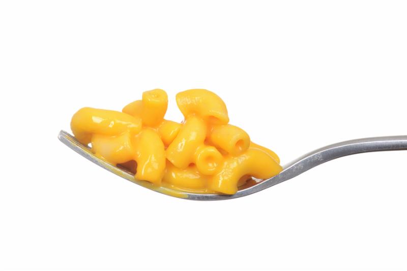 isolated macaroni and cheese on a fork with white background
