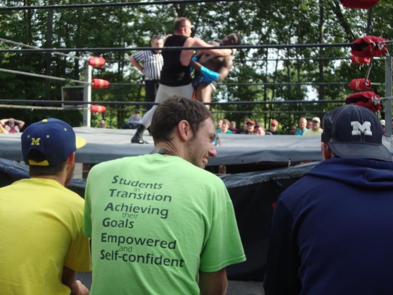 Stages students watching a wrestling event