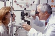 doctor giving eye exam to patient