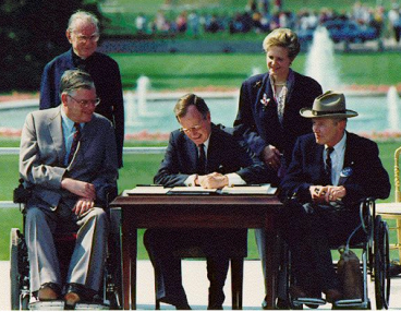 President Bush signs the ADA in 1990
