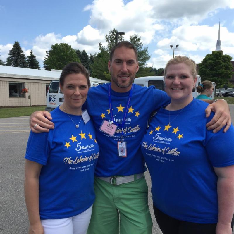 Kevin Lozo with two staff members from Lakeview of Cadillac