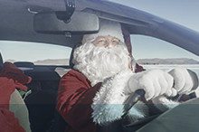 Santa Claus driving a car