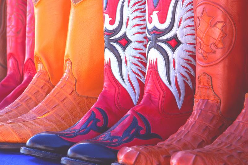 colorful cowboy boots lined up in a row
