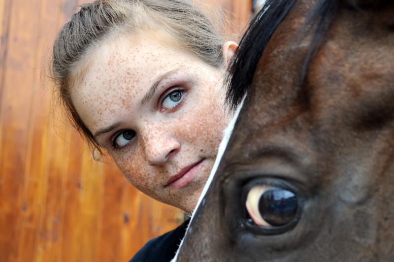 teenage girl and horse , conceptual image