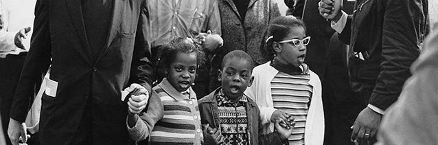 Abernathy children (Donzaleigh, Ralph David, and Juandalynn) march on the front line, followed by Dr. and Mrs. Martin Luther King, leading the Selma to Montgomery March in 1965, Abernathy Family Photos.