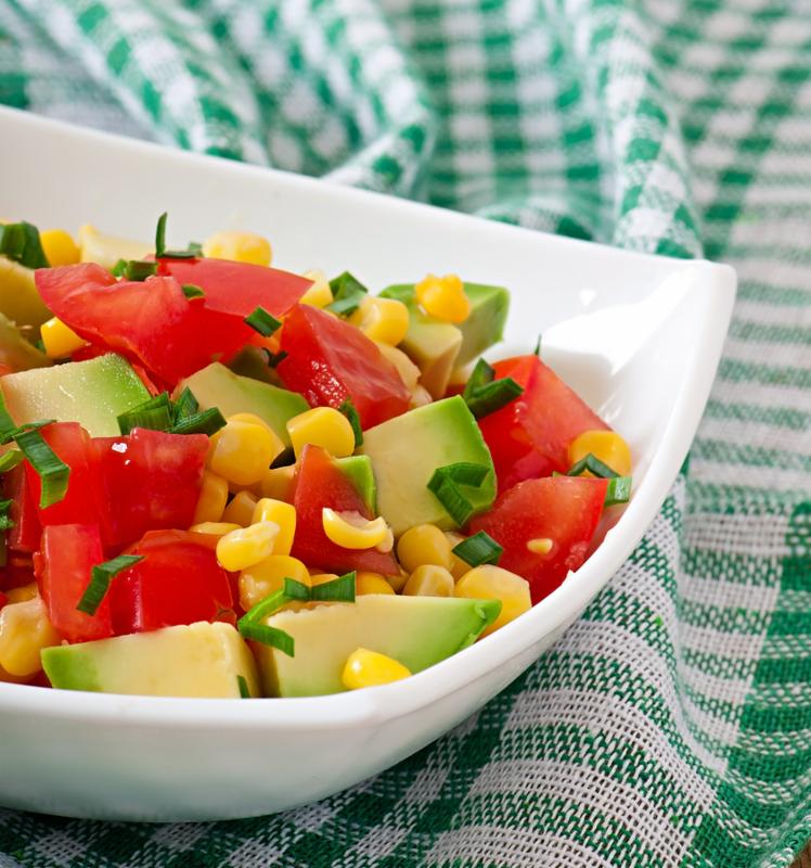 Mixed salad with avocado, tomatoes and sweet corn