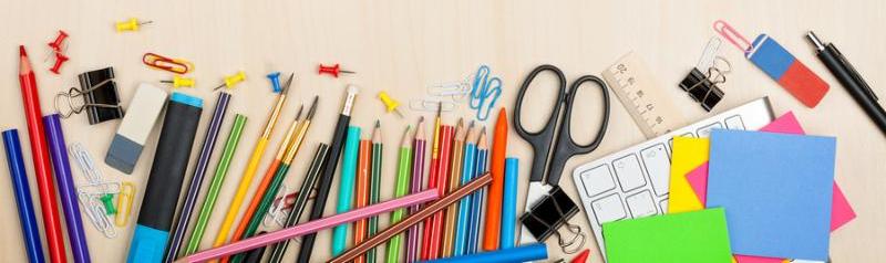 School and office supplies over office table. Top view with copy space