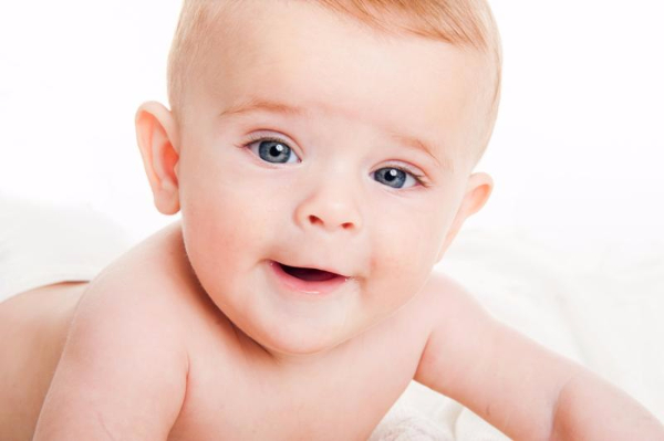 cute little boy of 4 months on a white background