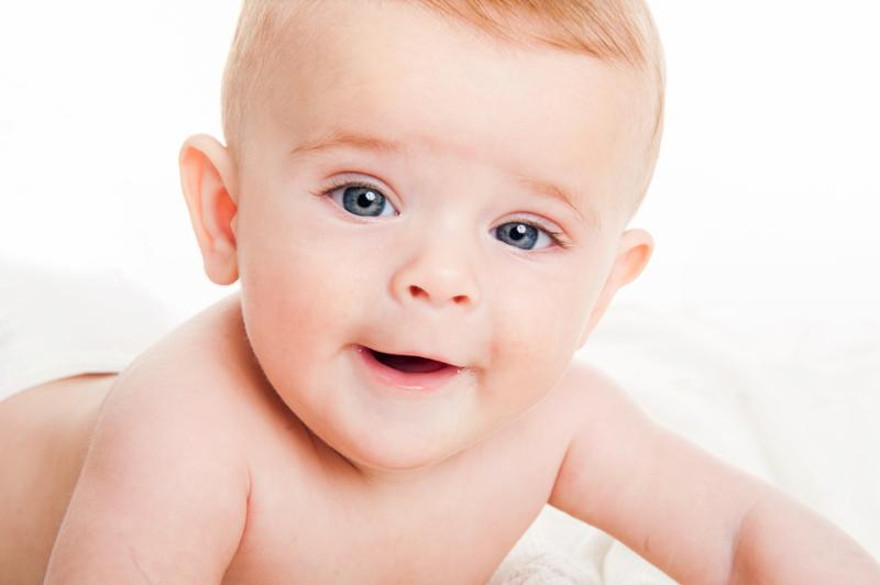 cute little boy of 4 months on a white background