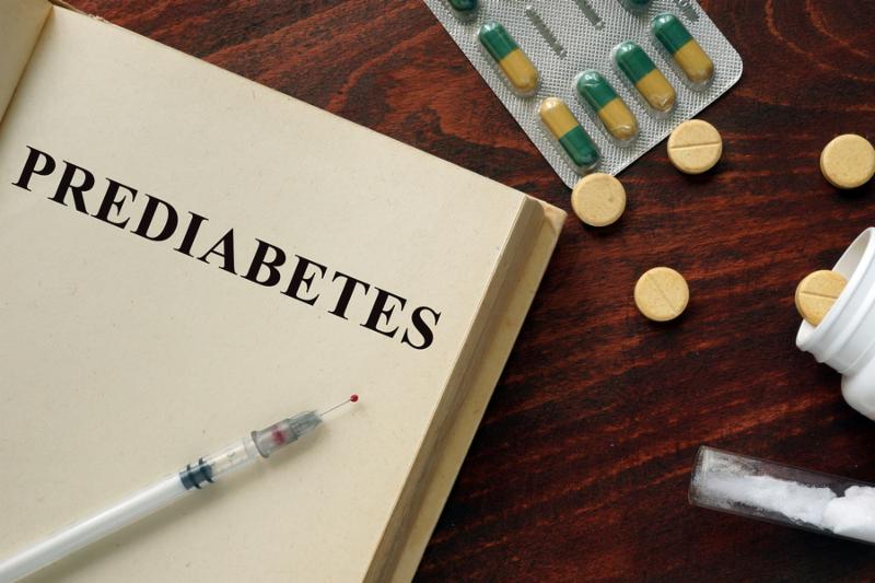 Prediabetes written on a book. Medical concept.