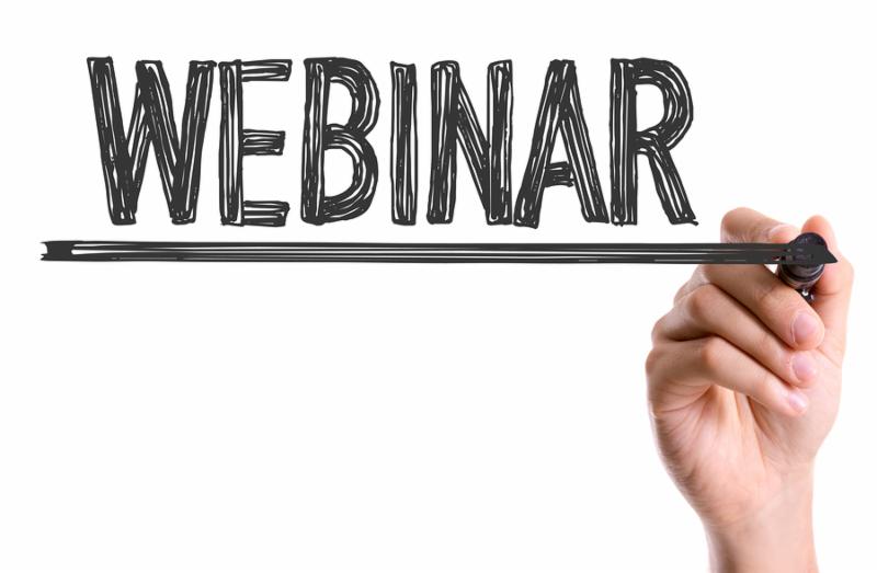Hand with marker writing the word Webinar