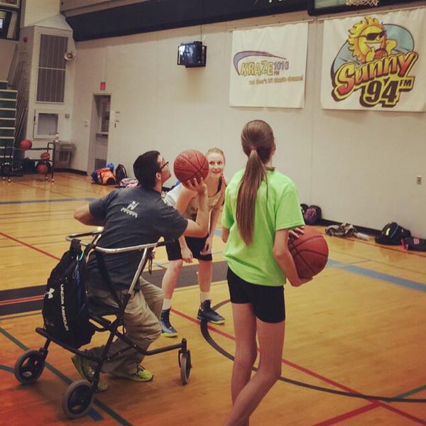 Swoosh! Shooting hoops in basketball camp.