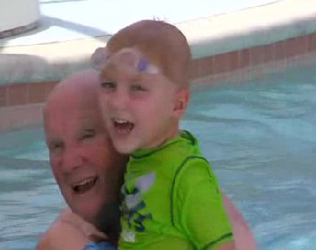 Gary Lee and grandson in pool