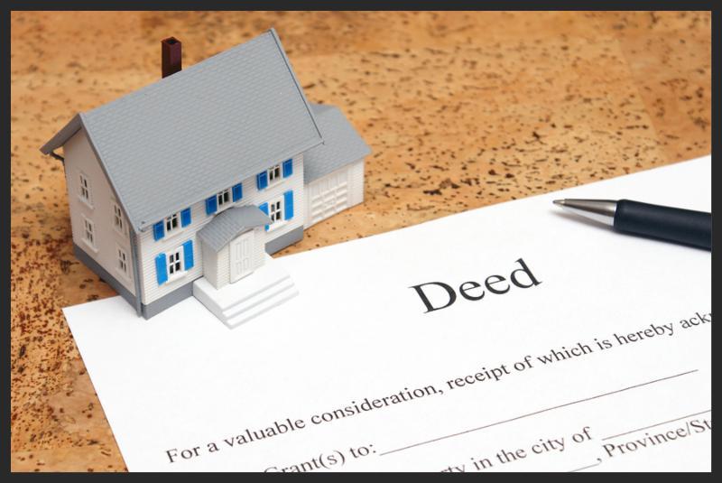 A scale house on some forms for a deed to conceptualize on the financial investment.