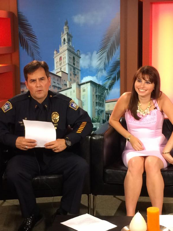 Lt. Barta and Haley Moss sitting in the filming studio and getting ready to film the 2nd Wallet Card Training Video. 