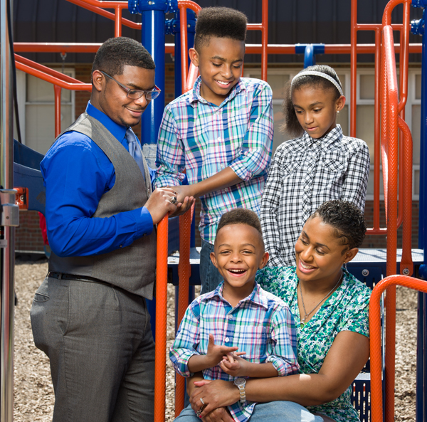  The Scott family pictured at Glenn O. Swing Elementary School in Covington. Sitting: Justus and Sophia. Standing: John, Jackson, and Joy.