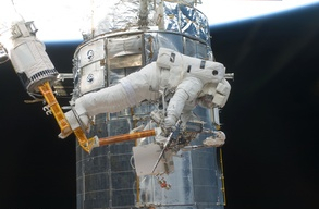 Astronaut Andrew Feustel on an EVA with power tool
