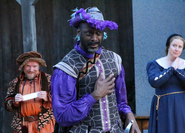 IMAGE: Sir Andrew Aguecheek (Brace Evans) gallantly departs to meet his foe, while Sir Toby (Gary Fetterplace) and Maria (Kristi Ann Jacobson) watch with bemusement in The BPA Shakespeare Society's 2014 production of Twelfe Night. Photo: Kim Scott-Olson